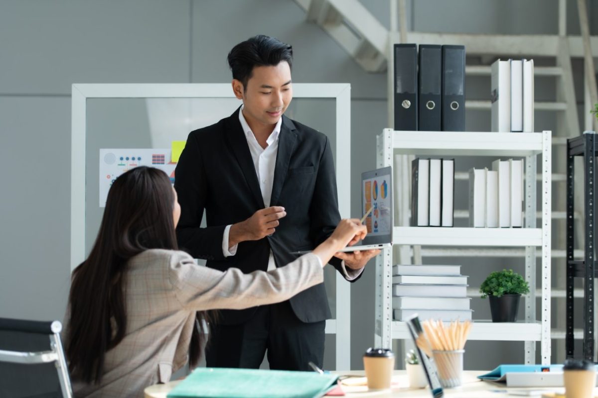 a-group-of-young-asian-entrepreneurs-top-management-is-meeting-to-review-stock-investment-data-e1701763611875