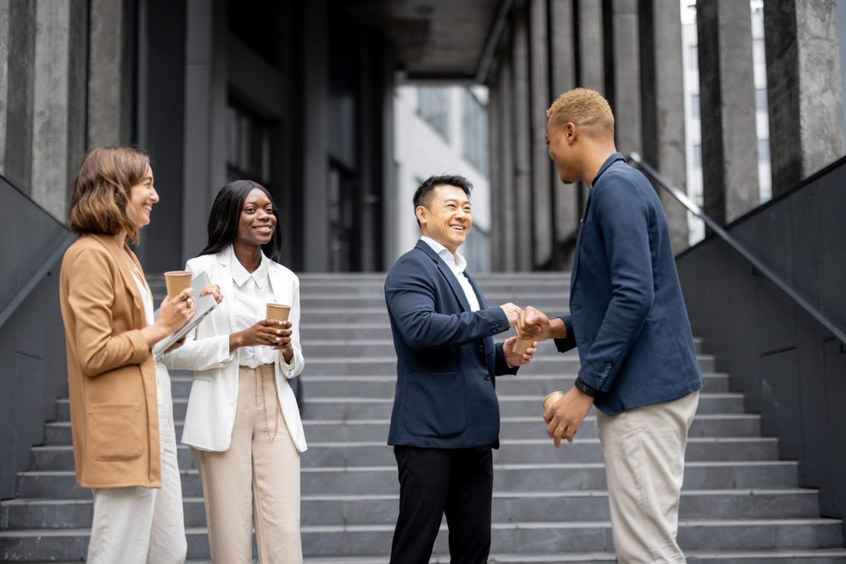 multiracial-business-team-bumping-fists-each-other-e1701763601844