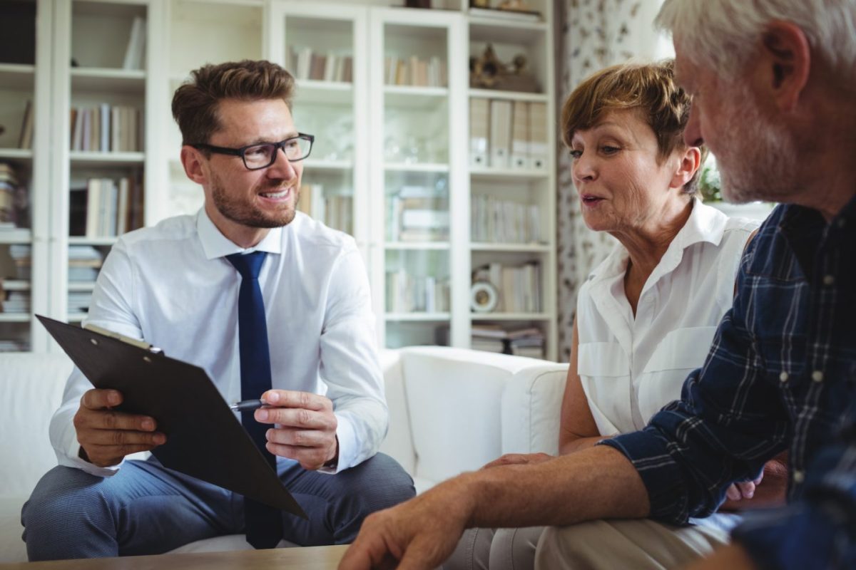 senior-couple-planning-their-investments-with-financial-advisor-e1701763567901